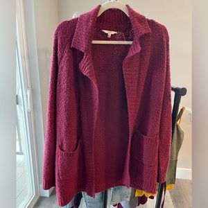 Warm fuzzy cardigan with front pockets.
